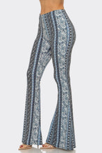 Load image into Gallery viewer, Flared pants with blue and white pattern on a light gray background
