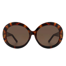 Load image into Gallery viewer, Sunglasses with tortoiseshell frame and dark lenses on a white background