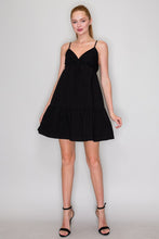 Load image into Gallery viewer, Woman wearing a black dress against a plain background