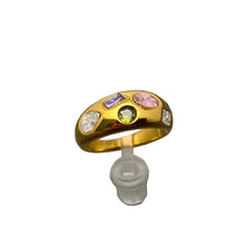 Load image into Gallery viewer, Gold ring with colorful gemstones on a gray textured background