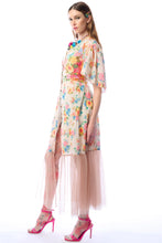 Load image into Gallery viewer, Woman wearing a floral dress with sheer sleeves on a white background