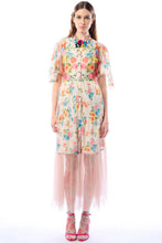 Load image into Gallery viewer, Model wearing a colorful floral dress on a white background