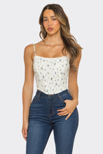 Load image into Gallery viewer, Woman wearing a white floral top and blue jeans on a plain background