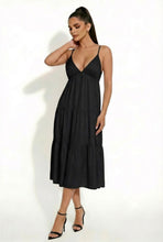 Load image into Gallery viewer, Woman wearing a black dress against a white background