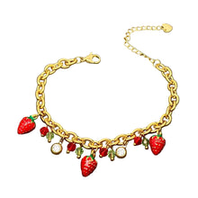 Load image into Gallery viewer, A gold-tone chain bracelet with dangling strawberry and leaf charms, photographed on a white background.