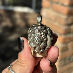Carved Bone Skull Pendant
