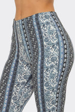 Load image into Gallery viewer, Patterned pants with blue and white design on a plain background

