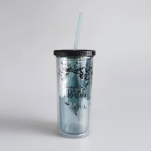 Load image into Gallery viewer, Clear tumbler with black lid and straw featuring a design and text on a light gray background
