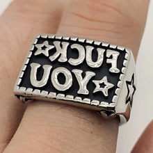 Load image into Gallery viewer, Silver ring with 'reverse FU' text on a finger
