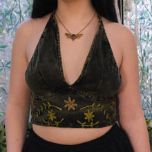 Load image into Gallery viewer, Person wearing a green embroidered crop top with a floral design.

