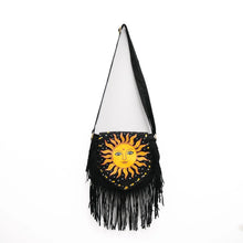 Load image into Gallery viewer, Black fringe bag with a sun design on a white background
