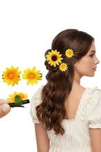 Load image into Gallery viewer, Woman with sunflower hair accessories and a hand holding additional sunflower clips on a white background
