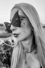 Load image into Gallery viewer, Black and white portrait of a person with sunglasses and visible tattoos.
