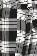 Load image into Gallery viewer, Close-up of a black and white plaid bag with a metal clasp.
