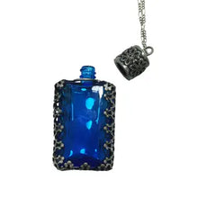 Load image into Gallery viewer, Filigree Metal Enclosed Blue Glass Bottle Necklace
