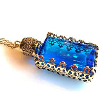 Load image into Gallery viewer, Filigree Metal Enclosed Blue Glass Bottle Necklace
