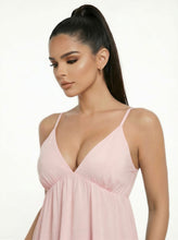 Load image into Gallery viewer, Woman wearing a pink dress with thin straps on a white background

