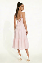 Load image into Gallery viewer, Woman wearing a light pink dress with thin straps on a white background
