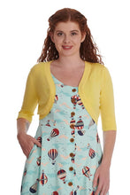 Load image into Gallery viewer, Woman wearing a yellow cardigan over a dress with hot air balloon pattern on a white background

