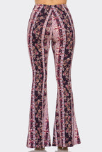 Load image into Gallery viewer, Flared pants with a purple and pink pattern on a white background
