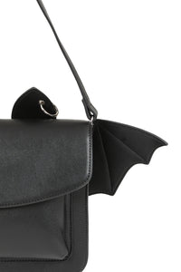 Black handbag with bat-wing design on a white background