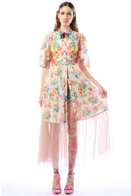 Load image into Gallery viewer, Woman wearing a colorful floral dress with a sheer overlay on a white background
