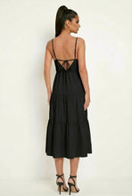 Load image into Gallery viewer, Woman wearing a black dress with a backless design on a white background
