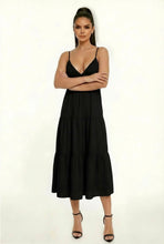 Load image into Gallery viewer, Woman wearing a black dress with a white background
