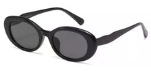 Load image into Gallery viewer, Black sunglasses with dark lenses on a white background
