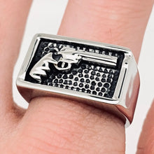 Load image into Gallery viewer, Silver ring with gun design on a finger
