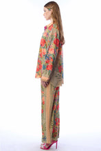 Load image into Gallery viewer, Woman wearing a floral outfit with a long skirt on a white background
