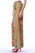 Load image into Gallery viewer, Floral print pants with a plain background
