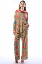 Load image into Gallery viewer, Woman wearing a floral outfit on a white background
