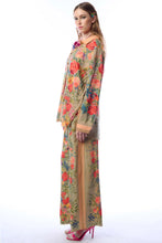 Load image into Gallery viewer, Woman wearing a floral dress with a plain background
