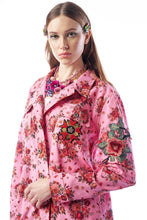 Load image into Gallery viewer, Woman wearing a pink floral coat with colorful flower designs on a white background
