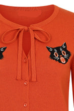 Load image into Gallery viewer, Orange shirt with black cat face designs.
