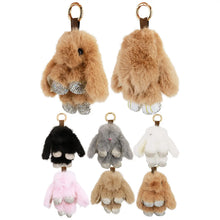 Load image into Gallery viewer, Set of fluffy keychain purse charms in various colors on a white background
