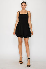 Load image into Gallery viewer, Woman wearing a black dress on a white background
