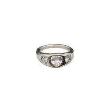 Load image into Gallery viewer, Silver ring with heart-shaped gemstones on a textured surface
