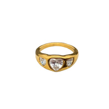 Load image into Gallery viewer, Gold ring with heart-shaped gemstones on a textured surface
