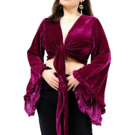 Purple velvet top with long sleeves and a knot detail on a white background