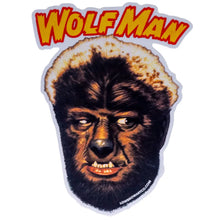 Load image into Gallery viewer, A die-cut sticker featuring the 'Wolf Man' movie character with a detailed werewolf face and the title 'WOLF MAN' in bold red and yellow lettering above, shown on a plain white background.
