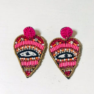 pink beaded evil eye earrings